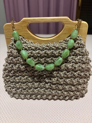 Handmade knitted beige bag with wooden magnetic clasp and beaded handle