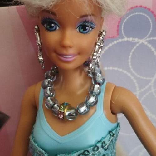 Vintage Barbie doll with handmade shoes and accessories