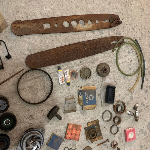 Various old chainsaw and small engine parts used