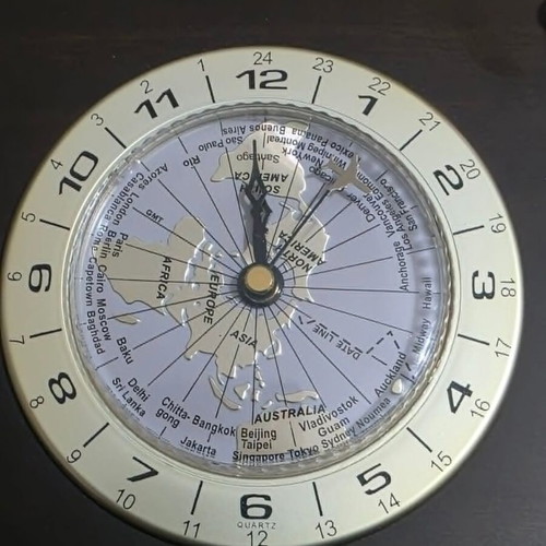 Luxury analog desk clock with world map and airplane needle
