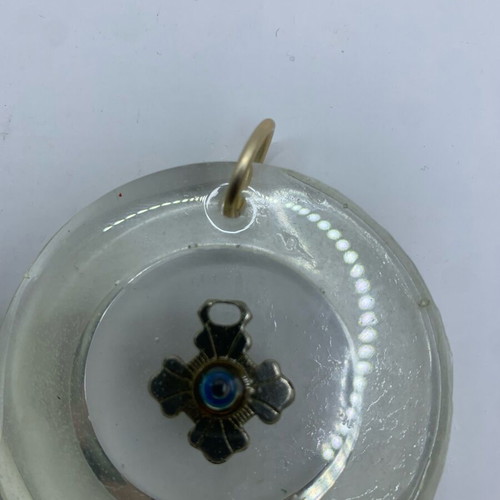Silver cross with eye and wooden cross in liquid glass new