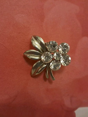 Pin with rhinestones like new, silver, flower-shaped