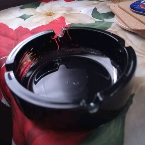 Glass ashtray vintage black classic with four cigarette slots used