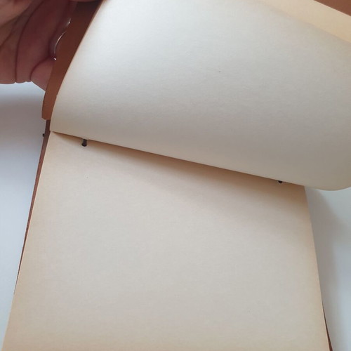 Handmade notebook with leather cover and metal airplane