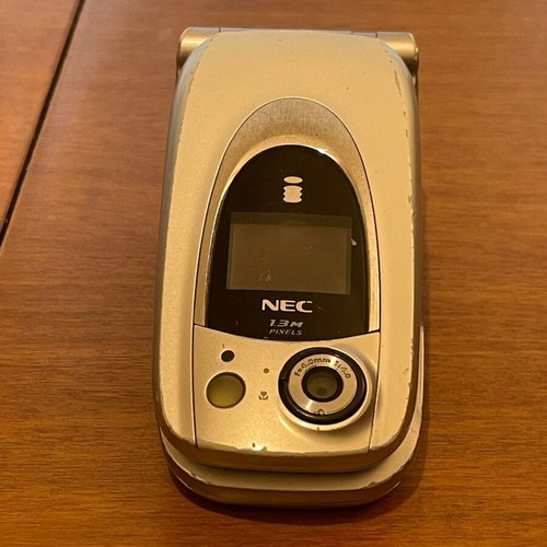 NEC 410i mobile phone used with charger and handsfree