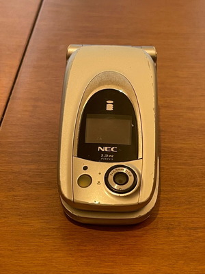NEC 410i mobile phone used with charger and handsfree