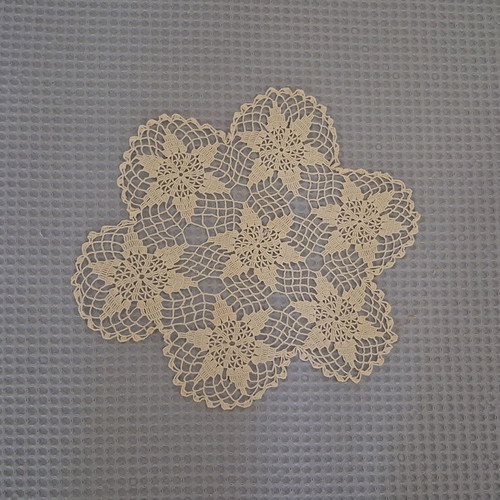 Round beige doily used, diameter 29 cm