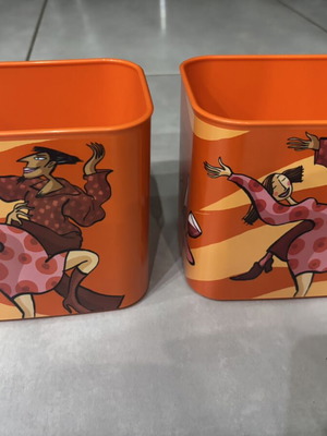 Tupperware canister with figures