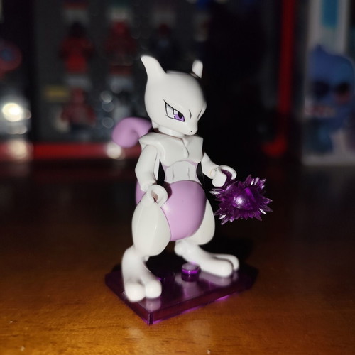 Mewtwo Pokemon figure with purple energy blast base