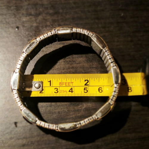 Magnetic stretch bracelet like new, gold color with amethyst decoration