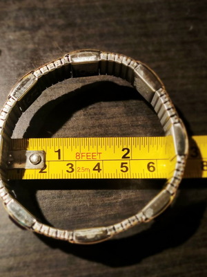 Magnetic stretch bracelet like new, gold color with amethyst decoration