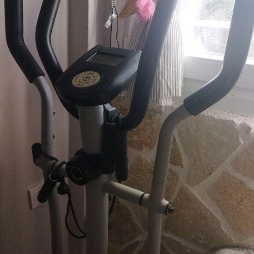 Elliptical machine used for full body fitness and exercise