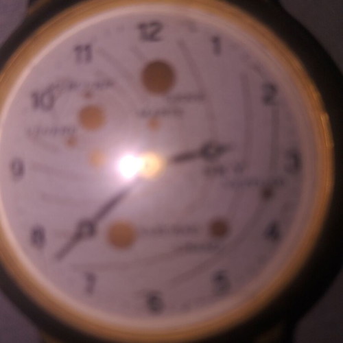 Wristwatch with planet design used, brown leather strap