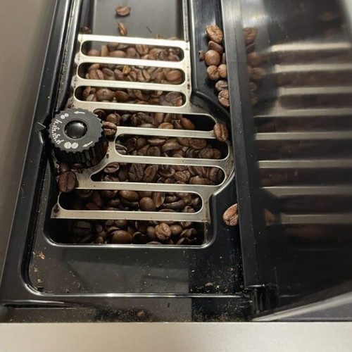 Delonghi Magnifica coffee maker used with grinder and milk frother