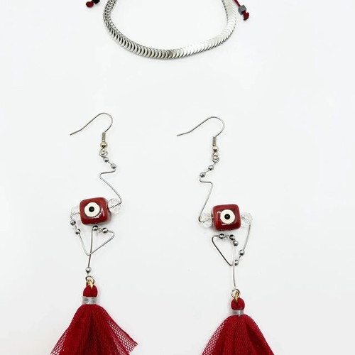 Handmade earrings with ceramic eye element and tassel, like new