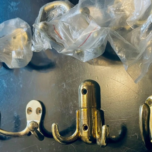 Double and single gold-coloured wall hooks