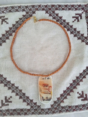 Short handmade necklace orange lurex with white car design