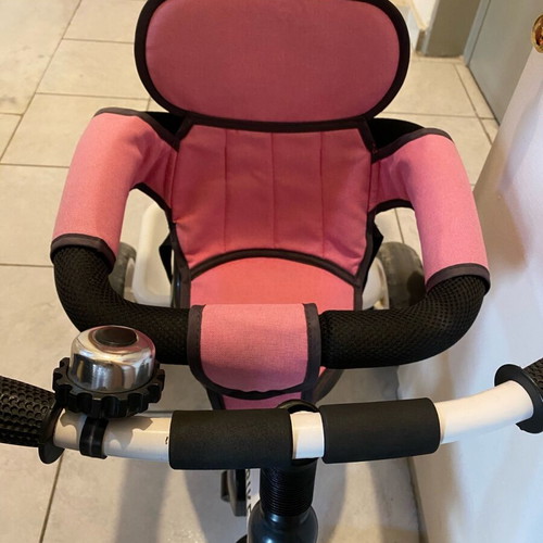 Tricycle pink with parent-controlled steering used