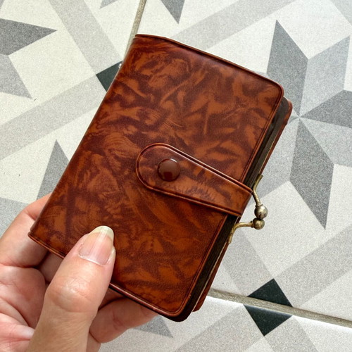 Vintage brown leather wallet used with frame closure