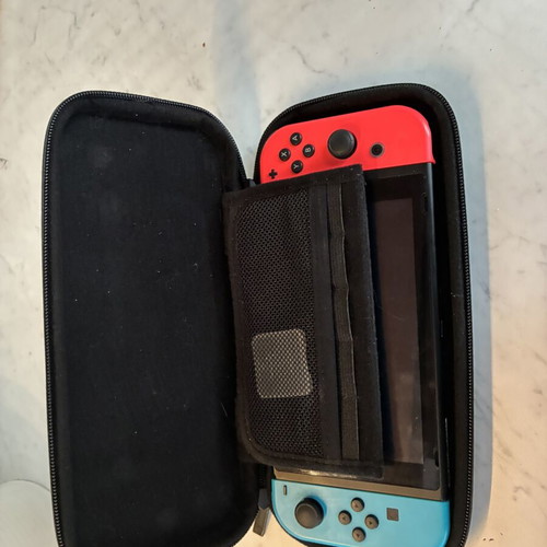Nintendo Switch V2 console used with 2 games and carrying case