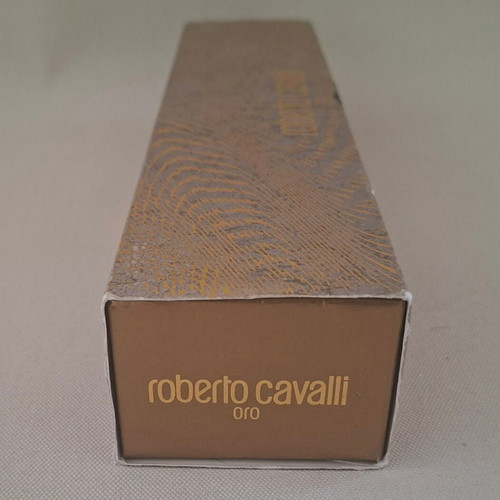 Roberto Cavalli Oro and Christian Dior J'adore empty perfume bottles