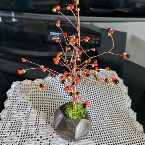 Decorative handmade tree with plaster base and painted details