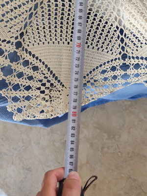 Handmade round crochet tablecloth