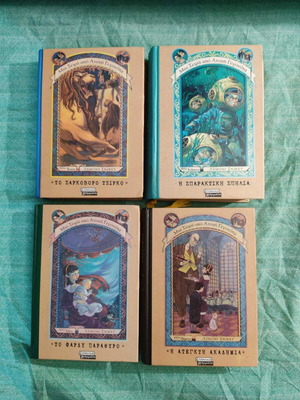 A Series of Unfortunate Events 4 used books with small coffee stain
