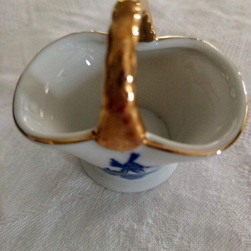 Porcelain decorative basket vintage with blue windmill and gold handle like new