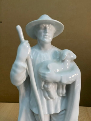Porcelain figure of shepherd with lamb like new