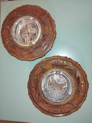 Vintage ashtrays made of glass and wood with carved details