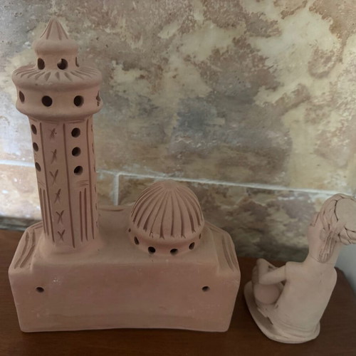 African clay decorative set with figure and palace