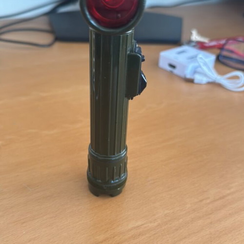 Handheld and pocket flashlight used, with clip and red filter