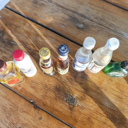 Collection of 7 collectible vintage sealed mini liquor bottles new