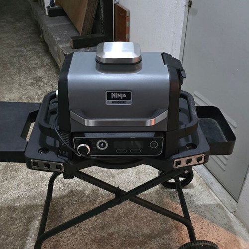 Ninja Woodfire OG701EU Electric BBQ Grill & Smoker used with stand and accessories