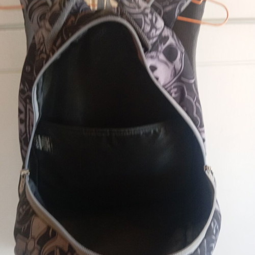 Polo character school backpack with multiple compartments