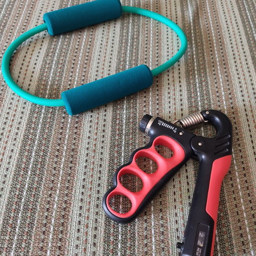 Fitness tools set of 2 used, hand grip and stretching band