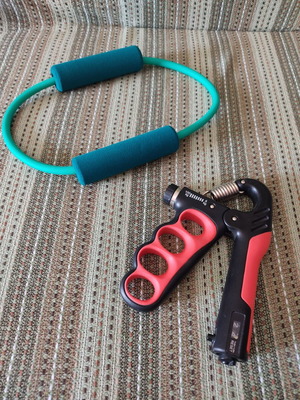 Fitness tools set of 2 used, hand grip and stretching band
