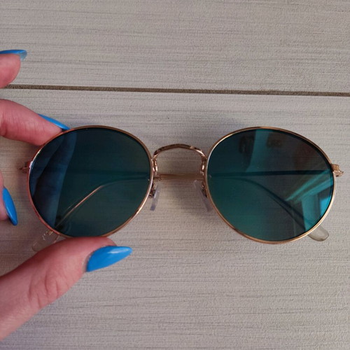 Sunglasses with blue mirror lenses and gold frame