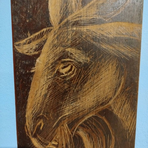 Woodcut goat head design on old wood new