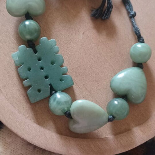Bracelet with green stones, hearts and luck symbol like new