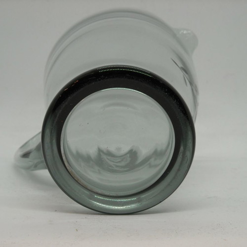 Vintage water pitcher made of blown glass used, gray with floral engravings