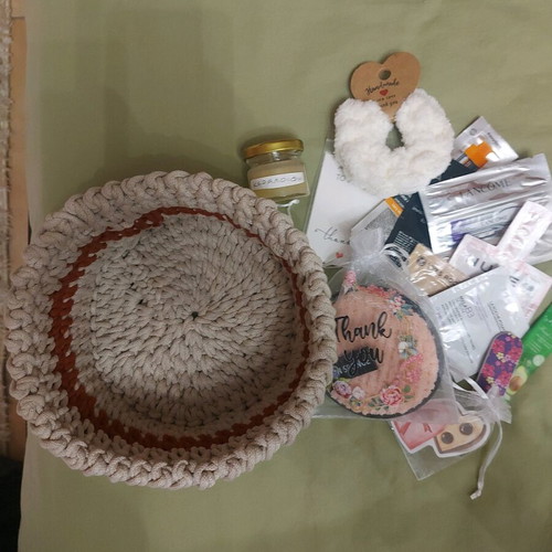 Knitted basket like new with gifts made of macrame cord