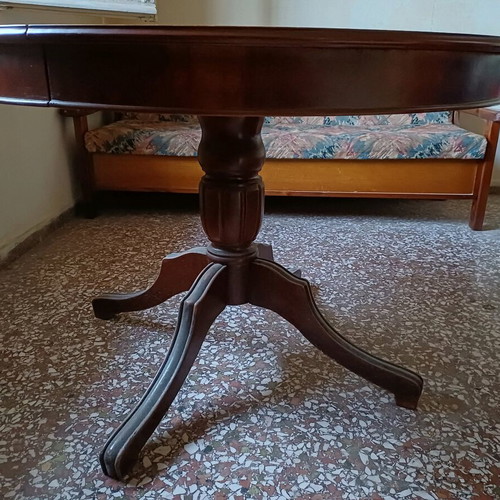 Round table with red tablecloth used, vintage wood design
