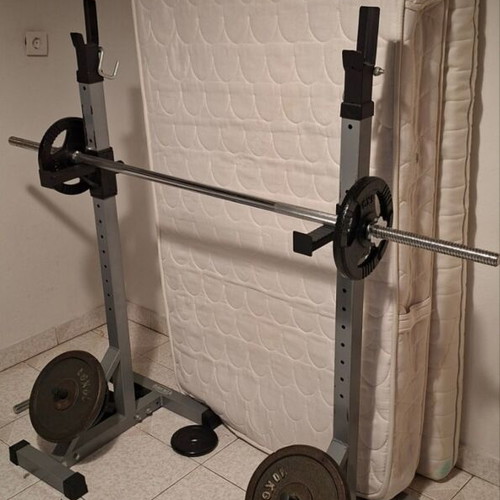 Weight bench with adjustable barbell stands and weights