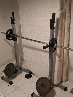Weight bench with adjustable barbell stands and weights