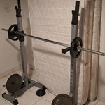Weight bench with adjustable barbell stands and weights