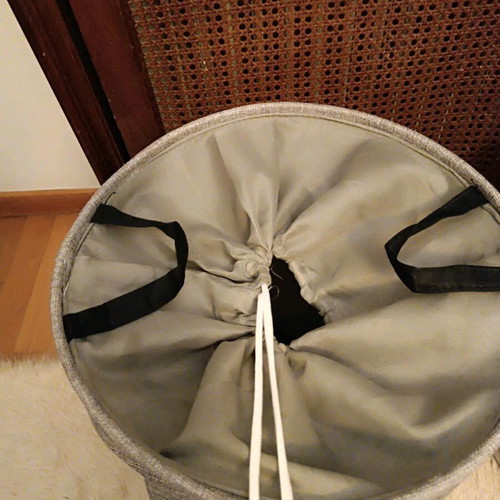 Fabric laundry basket like new with closing strap, gray