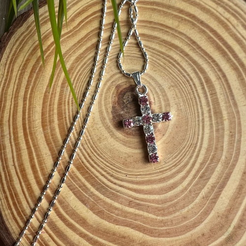 Cross like new with white and pink details