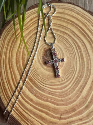 Cross like new with white and pink details